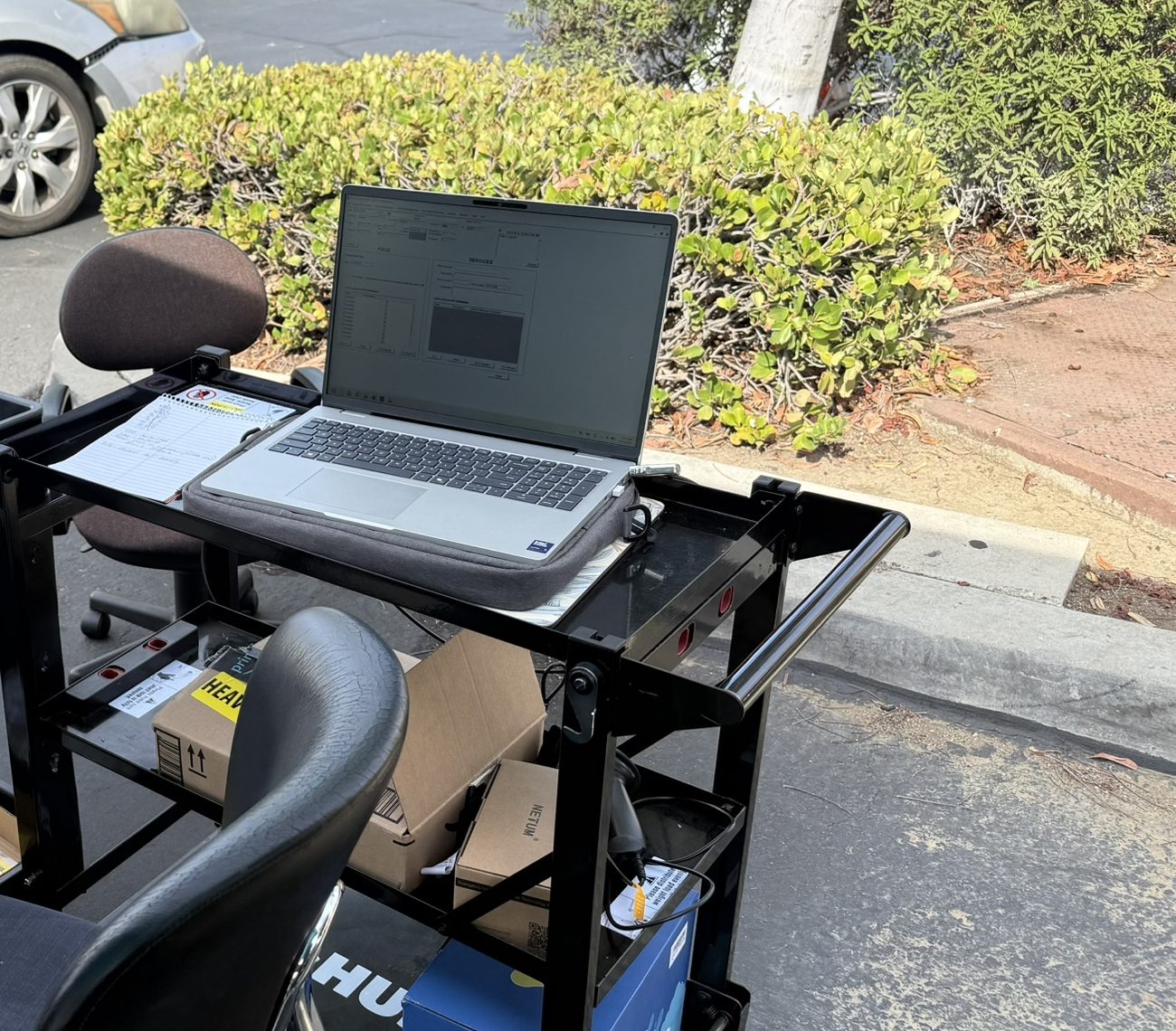 Laptop on a check-in cart running Food Pantry System