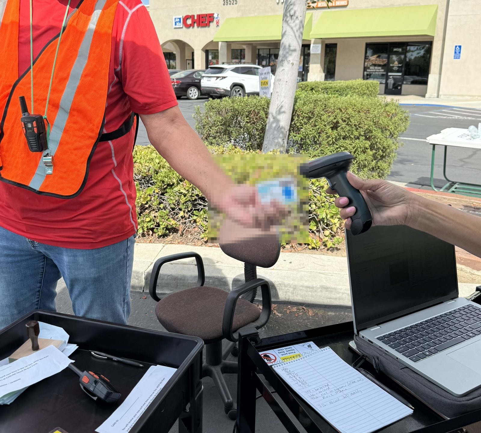 Barcode ID card being scanned at outdoor check-in